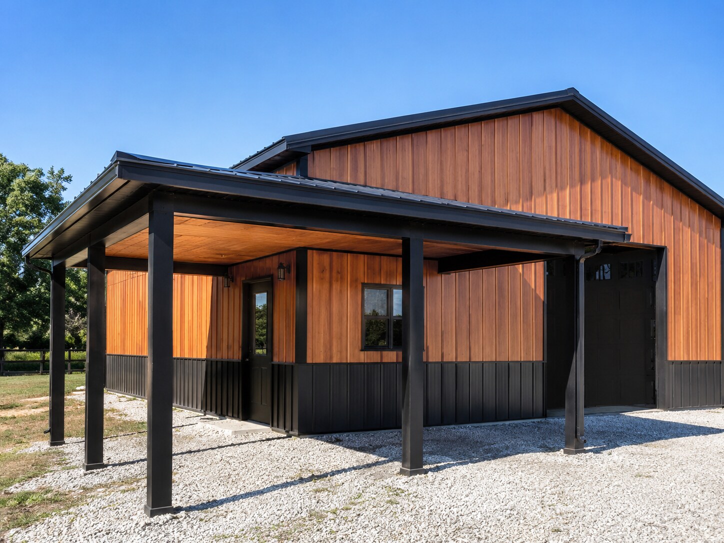 Dark and copper-toned post-frame building with timber porch